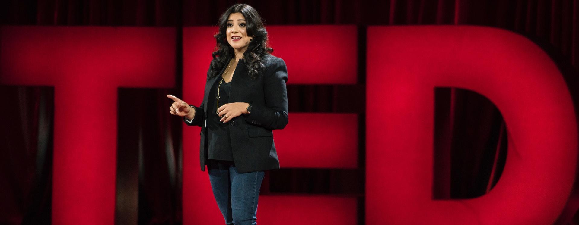 Reshma Saujani Speaking On Stage With TED Logo Behind Her