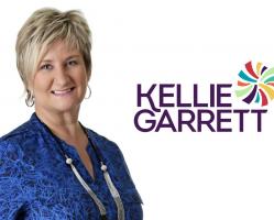 Corporate Photo Of Kellie Garrett On White Background With Her Name And Logo Beside Her