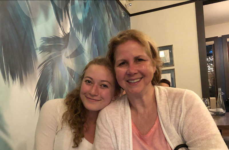 Carolyn Cross Sitting With Daughter Anna