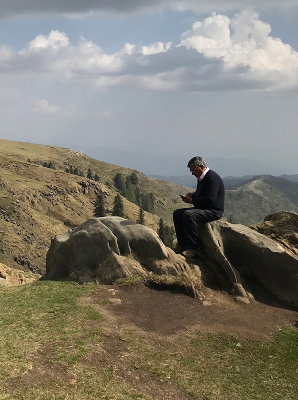 Farzana Baduel Father Sitting On Rock At The Top Of Mount Toli Pir In Pakistan