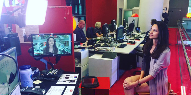 Farzana Baduel Sitting On Stool With many Lights And Camera For Interview At BBC Studio London England