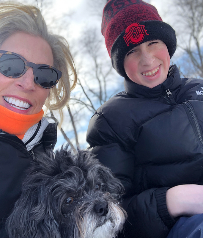 Jan Singer Posing For Photo With Son And Family Dog Outdoors In Winter
