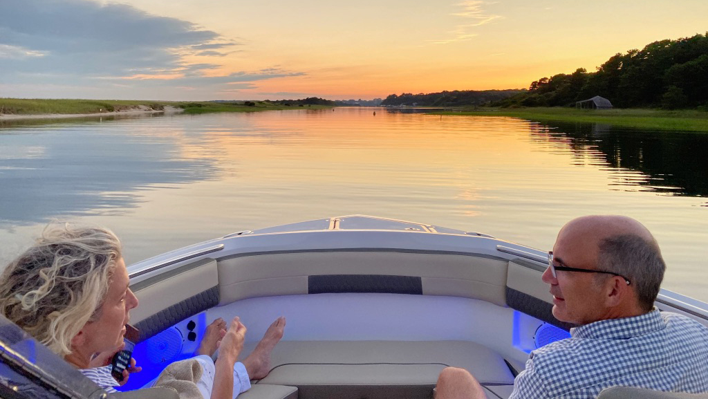 Jan Singer And Husband David Sitting On Boat And Relaxing