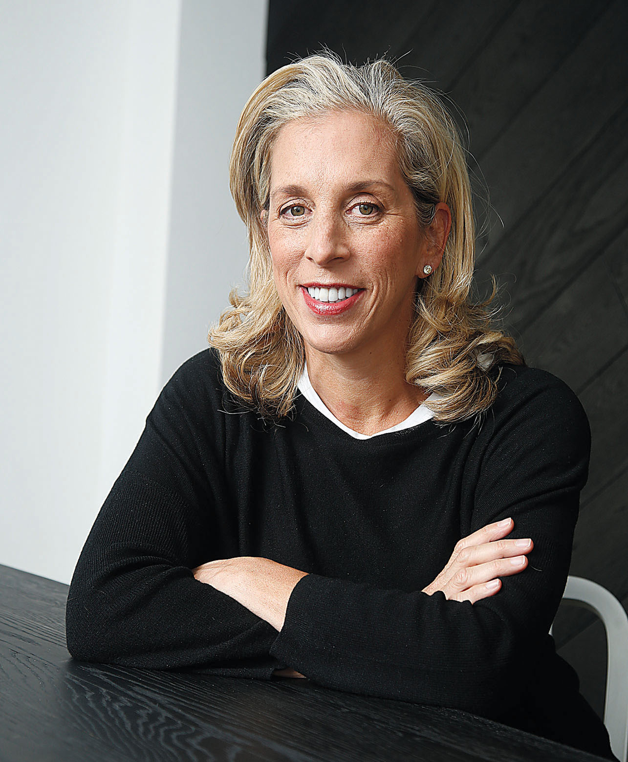 Jan Singer Smiling For Corporate Photo In Black Shirt