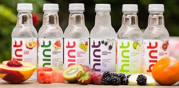 Line Different Flavoured Hint Water Bottles On Table