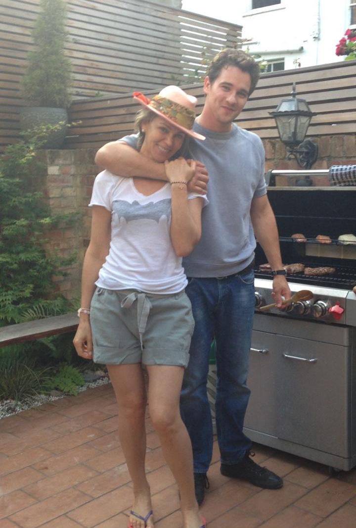 Valerie Levine With Son Alex On Patio Beside Grill