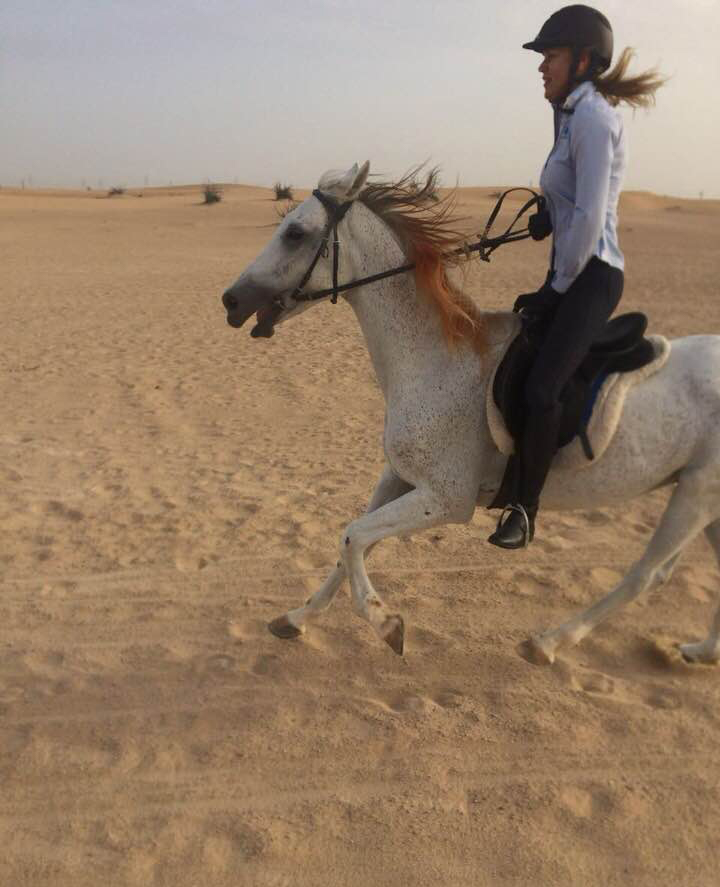 Valerie Levine Riding White Horse In Desert Near Dubai