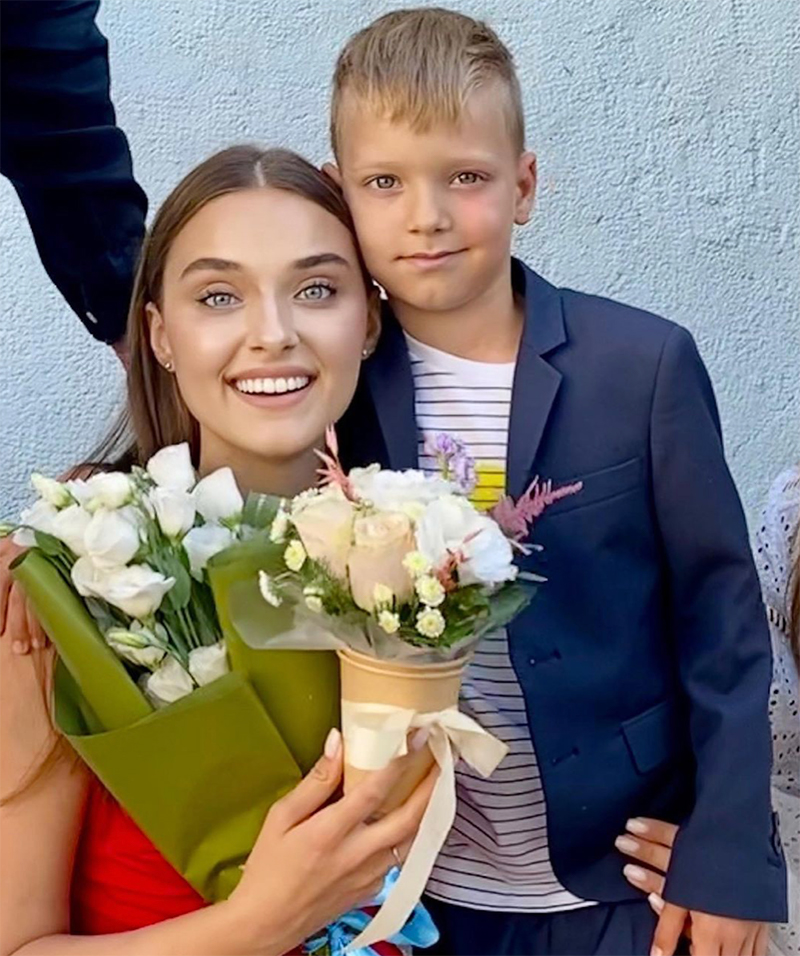 Veronika Didusenko Holding Flowers With Her Son Alex 