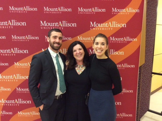 Vianne Timmons With Her 2 Children Posing For Photo With Mount Allison University Photo Backdrop